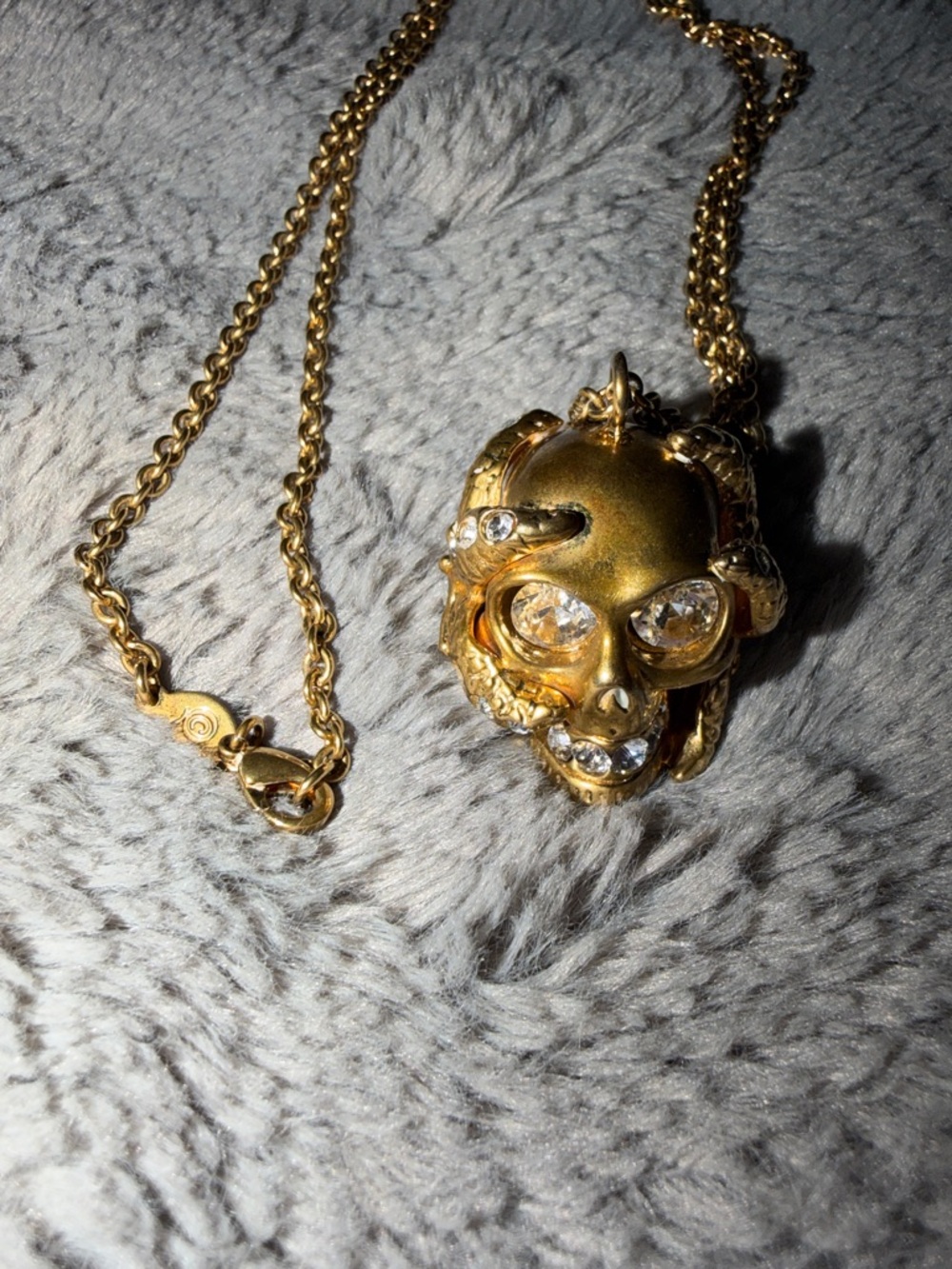 Preloved Alexander McQueen Gold Skull Pendant Necklace with Crystal Accents.